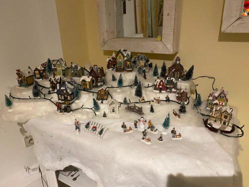 a model of a christmas village on a table at Spacious apartment in Charleroi 100 m² with parking 5 ppl in Charleroi
