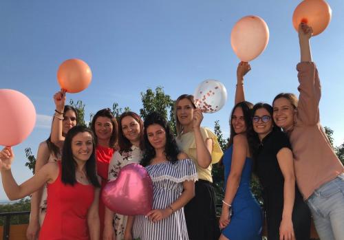 a group of women posing for a picture with balloons at Boom House Fruska Gora in Irig