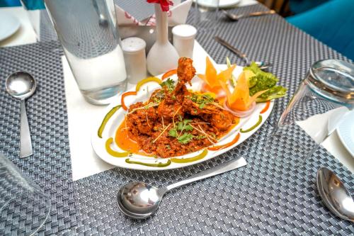 a plate of food sitting on top of a table at The Golden Apple in Lucknow