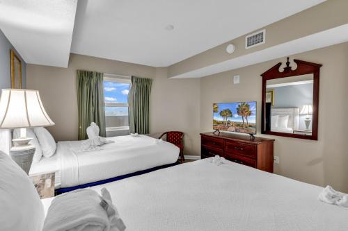 Katil atau katil-katil dalam bilik di Atlantica Oceanfront Condos