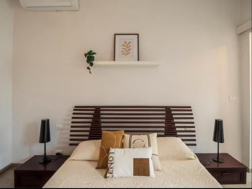 a bedroom with a bed with pillows on it at Casa Wilson in Turin