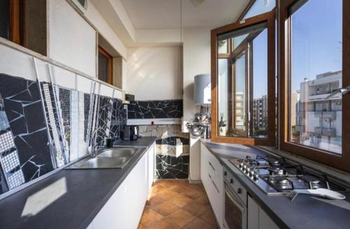 Kuchyň nebo kuchyňský kout v ubytování Salesiani rooms