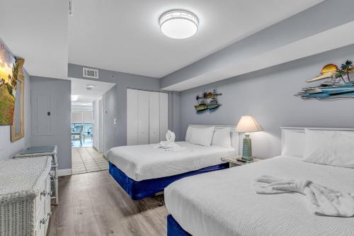Katil atau katil-katil dalam bilik di Atlantica Oceanfront Condos