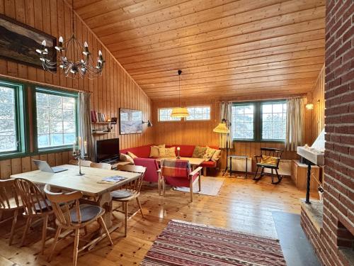 a living room with a table and a couch at Cozy cabin in Geilo in Geilo