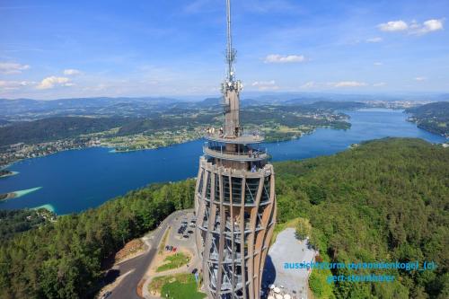 an observation tower with a view of a lake at Hotel Gabriel in Keutschach am See