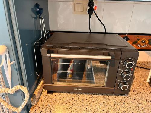 a toaster oven sitting on top of a counter at The Snow Chalet con Parking, Wifi y Terraza in Sierra Nevada