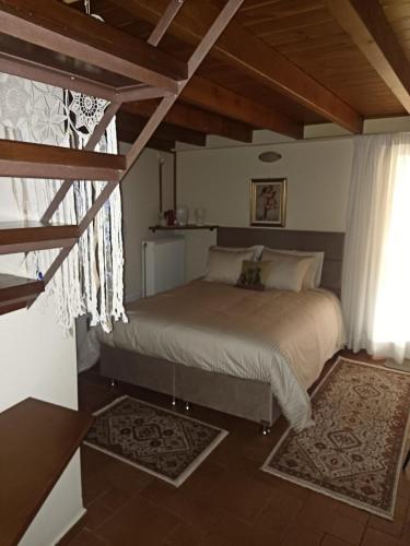 a bedroom with a bed in a room at Αρχοντικό Κορκόντζελου in Nafpaktos