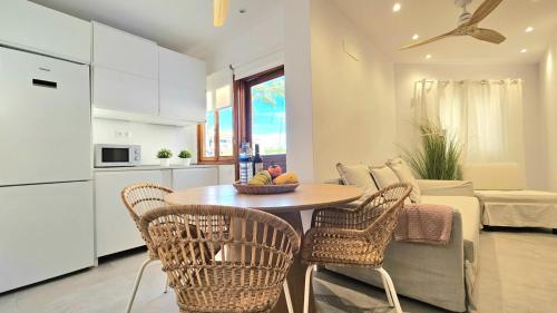 a kitchen and living room with a table and chairs at Aguaviva apartment in Callao Salvaje