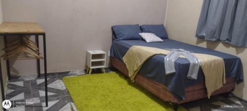 Ένα ή περισσότερα κρεβάτια σε δωμάτιο στο Ampla casa com acesso ao Rio