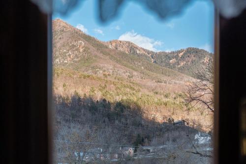 a view of a mountain from a window at Casa Daniela in Druogno