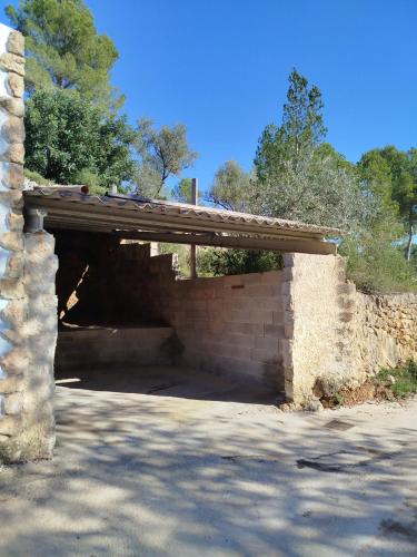 a brick tunnel with a wooden roof on top at EL CASTELLET in Traiguera