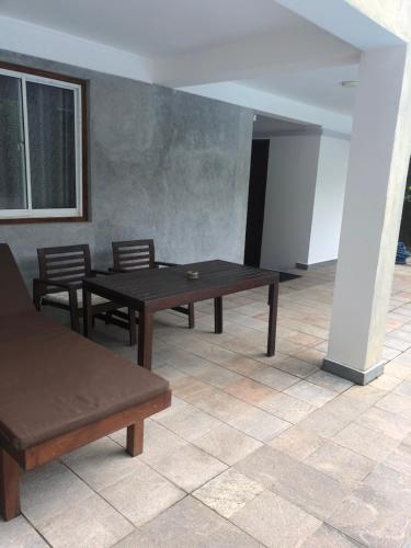 a room with two tables and chairs and a window at Hotel Paradiso, in Unawatuna