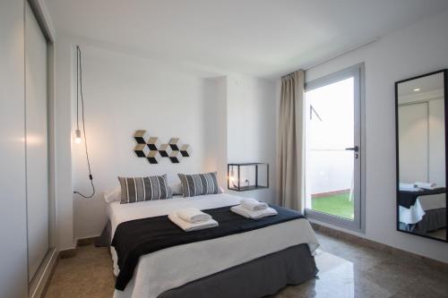 Postel nebo postele na pokoji v ubytování Apartamentos Marina Playa