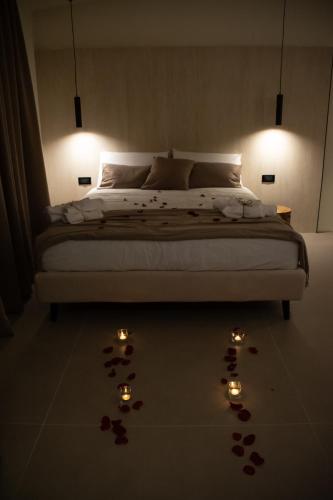 a bedroom with a bed with lights on the floor at Real suite spa in Palermo