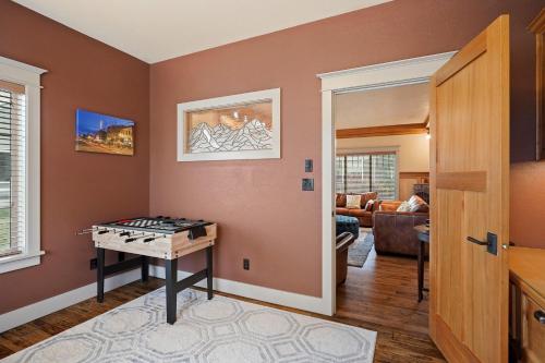 a living room with a foosball table in it at Awbrey in Bend