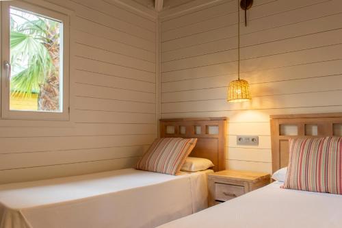 Postel nebo postele na pokoji v ubytování Cambrils Park Resort