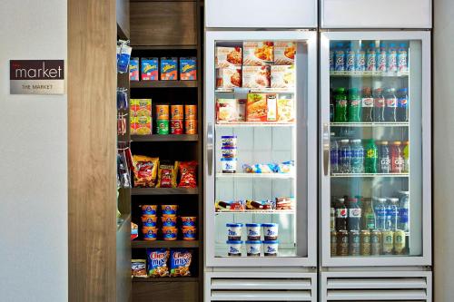 a refrigerator filled with lots of drinks and drinks at Residence Inn Minneapolis St. Paul/Roseville in Roseville