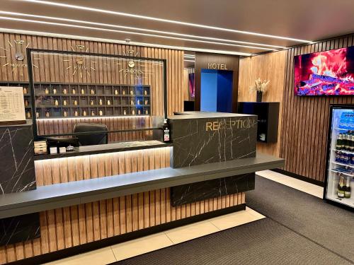 a wine tasting room with a counter with wine bottles at Yavir in Poltava