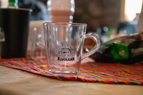 a glass mug sitting on top of a table at Refugio El Volcán in Angostura