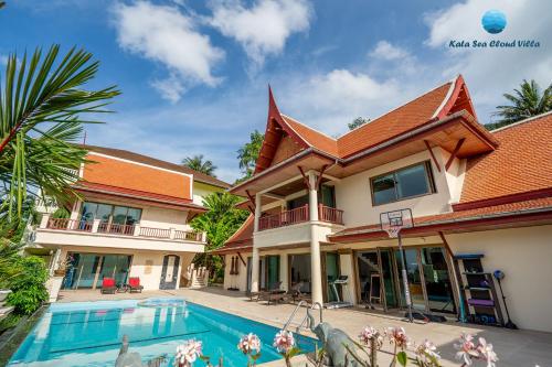 an image of a house with a swimming pool at Kata Sea Cloud Villa半山海景独栋别墅 in Kata Beach