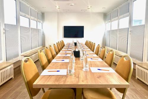 a large conference room with a long table and chairs at Jess Hotel & Spa Warsaw Old Town in Warsaw