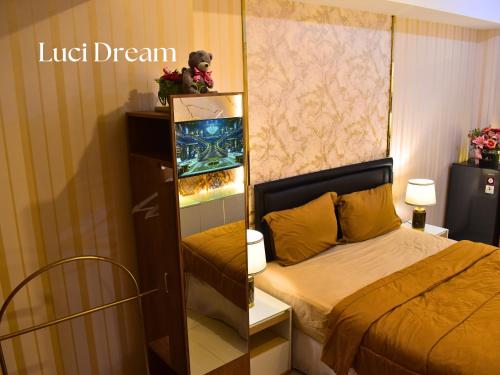 Ένα ή περισσότερα κρεβάτια σε δωμάτιο στο Luci Dream Benson Apartment at Supermal Pakuwon