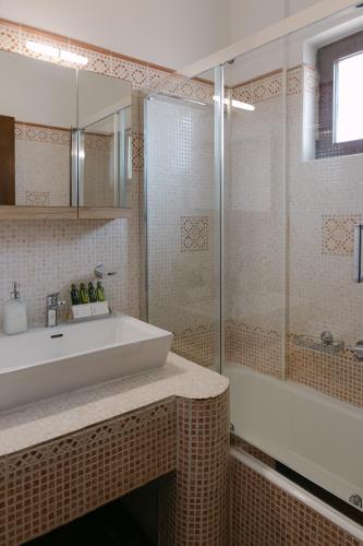 a bathroom with a sink and a shower at Greco Levantes Villas in Triopetra