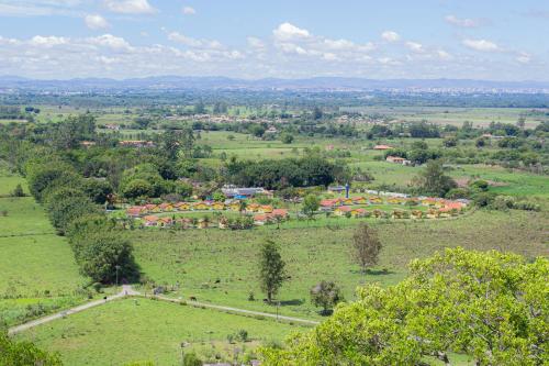 an aerial view of a farm in a field at Hotel Fazenda Pé da Serra in Bom Sucesso