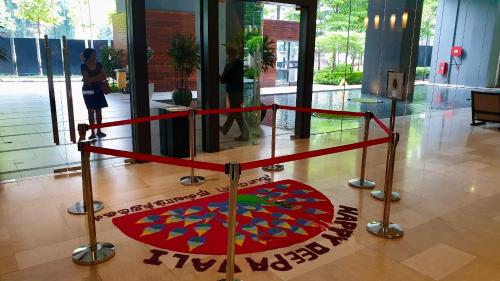 a display in a building with a red rug on the floor at M City Ampang KLCC Lake view Pool in Kuala Lumpur