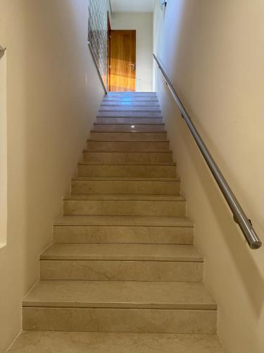 a stairway leading up to a door at Casa Serra dos Picos - Casa de Ferias, Braga in Braga