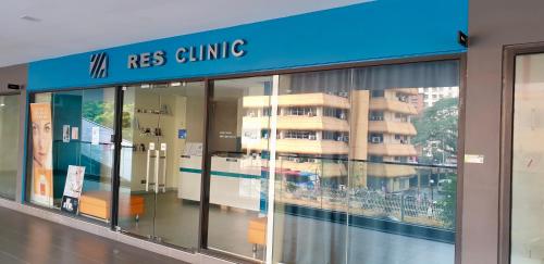a store front with glass windows in front of a building at M City Ampang KLCC Lake view Pool in Kuala Lumpur