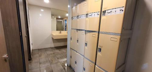 a bathroom with a bunch of lockers in a room at M City Ampang KLCC Lake view Pool in Kuala Lumpur