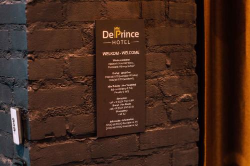 a sign on the side of a brick wall at City Spa Nijmegen in Nijmegen