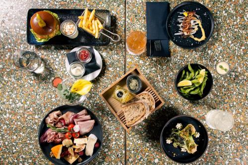 a table topped with plates of food on a table at Le Méridien Vienna in Vienna