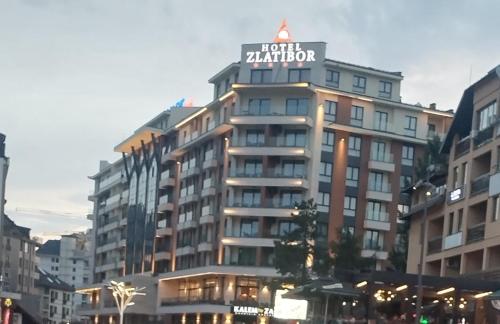 a building with a sign on top of it at Dream residence Lux apartment Zlatibor in Zlatibor