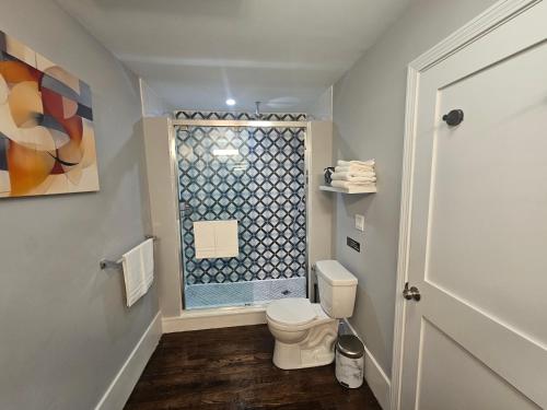 a bathroom with a toilet and a window at Brand New 4BR House 20Min Downtown Boston in Boston