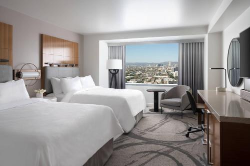 a hotel room with two beds and a window at JW Marriott Los Angeles L.A. LIVE in Los Angeles