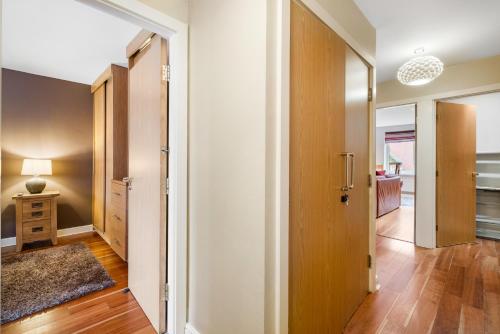an empty hallway with a door leading to a bedroom at The Jewellery Suites Birmingham in Birmingham