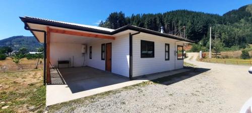 a small house with a large patio at Cabañas Eben-Ezer Parcela in Queule