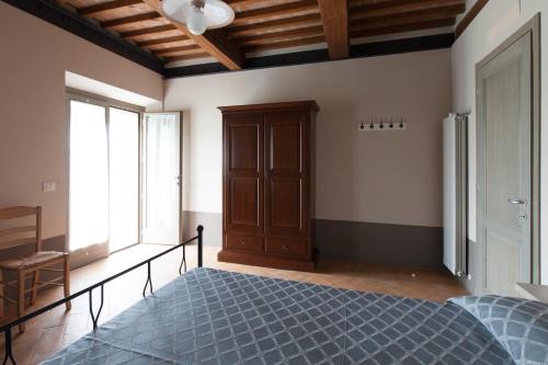 Cama o camas de una habitación en Agriturismo Bio Podere Doganelle