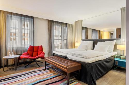 En eller flere senge i et værelse på Clarion Hotel Admiral