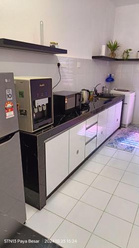 a kitchen with a sink and a counter top at Residensi Gambang Prima UMP in Gambang