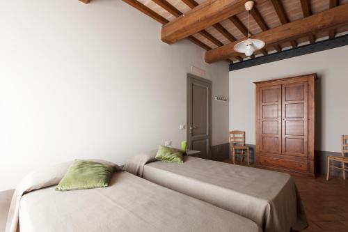 Cama o camas de una habitación en Agriturismo Bio Podere Doganelle
