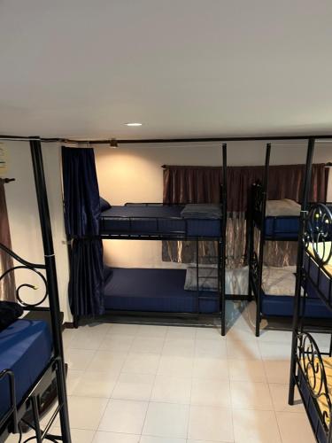 a group of bunk beds in a room at Moon Dolphin Hostel in Haad Rin