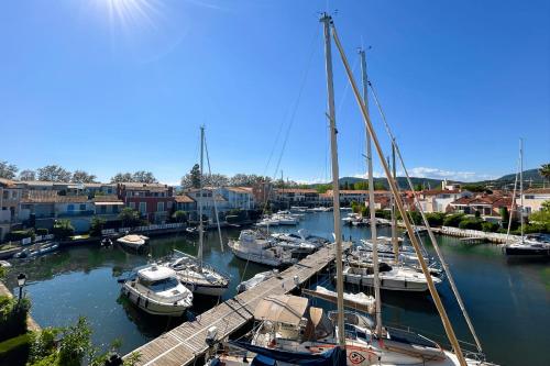 a group of boats docked in a harbor at This comfortable and bright apartment WIFI in Grimaud