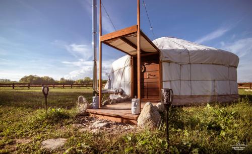 a yurt in the middle of a field at Agricampeggio Equinox in Carpignano Sesia