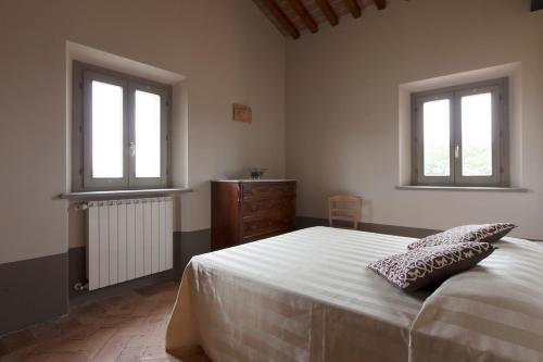 Cama o camas de una habitación en Agriturismo Bio Podere Doganelle
