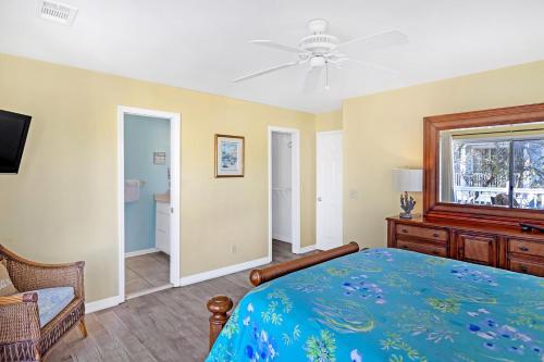 a bedroom with a bed and a ceiling fan at Tybee Tides 510A in Tybee Island