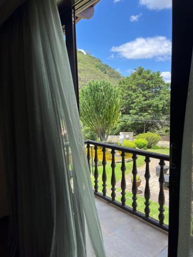 a view from a window of a balcony at Recanto dos Vianas in Teresópolis