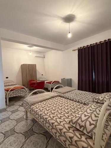 Postel nebo postele na pokoji v ubytování Villa IBRAHIMI
